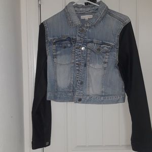 Acid wash denim jacket with leather sleeves